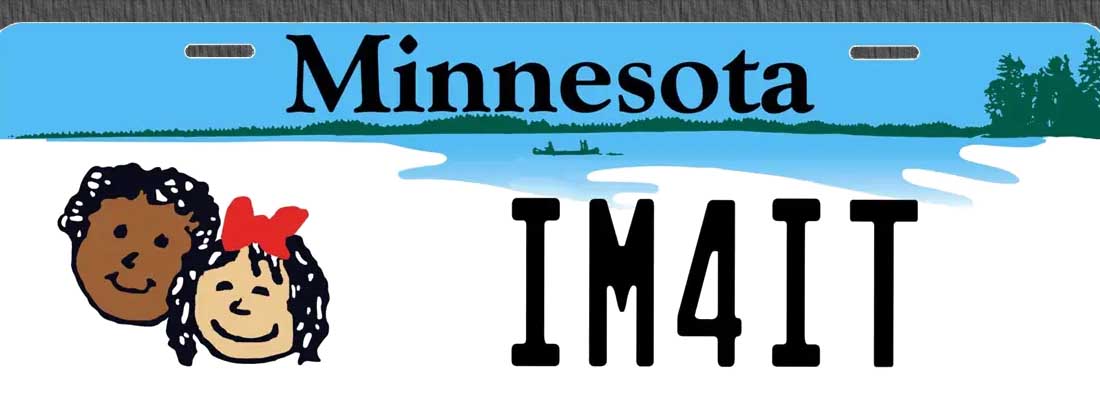 A minnesota license plate with the state name and picture of a boat in water.